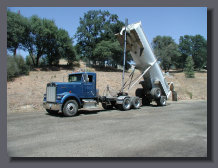 Semi end dump in full raised position