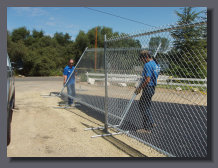 Rental fence being installed
